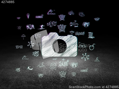 Image of Travel concept: Photo Camera in grunge dark room