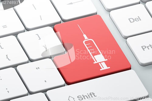 Image of Health concept: Syringe on computer keyboard background