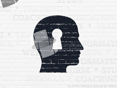 Image of Education concept: Head With Keyhole on wall background