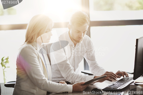 Image of business team with tablet pc computer at office