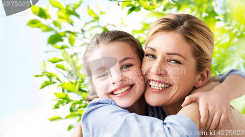 Image of happy family of girl and mother hugging