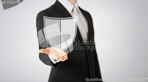 Image of man with virtual antivirus program icon