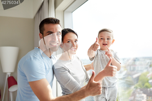 Image of happy family at window