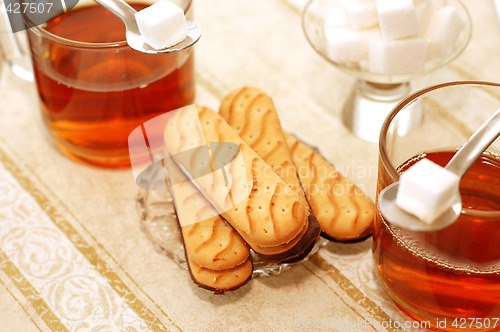 Image of table set for high tea with sweet cookies