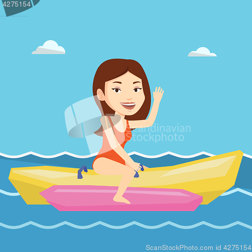 Image of Tourists riding a banana boat vector illustration.