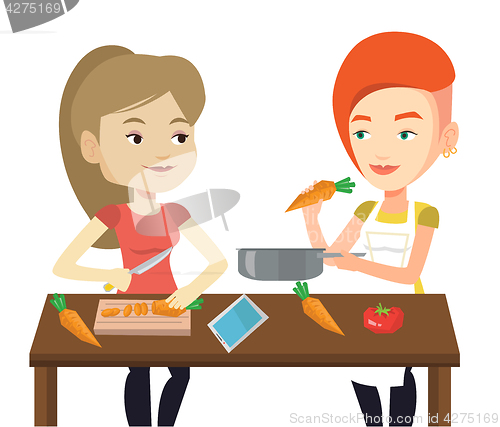 Image of Women cooking healthy vegetable meal.