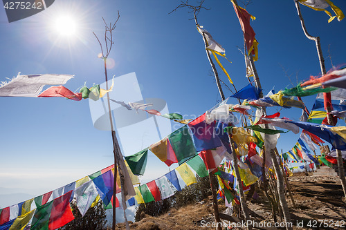 Image of Buddhist prayer flags on a mountaintop in the Himalayas