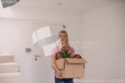 Image of girl moving in the new apartment