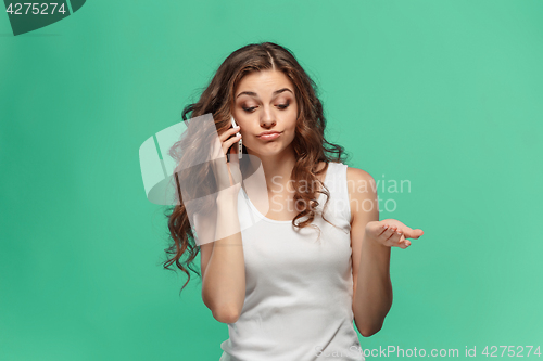 Image of The portrait of disgusted woman with mobile phone