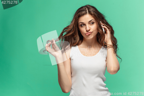 Image of Portrait of young woman with shocked facial expression