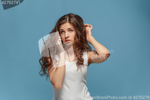 Image of The portrait of disgusted woman with mobile phone