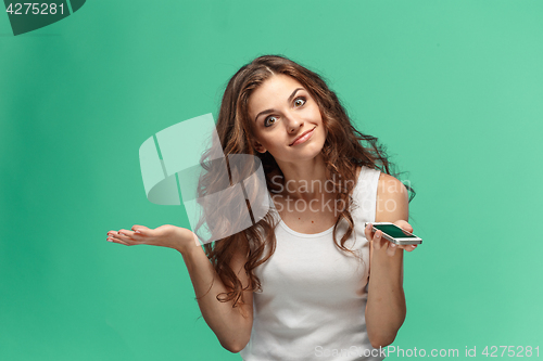 Image of Portrait of young woman with shocked facial expression