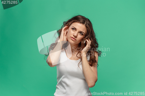 Image of The portrait of disgusted woman with mobile phone