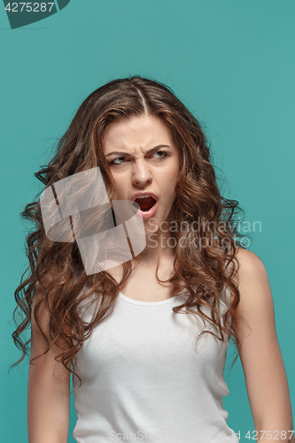 Image of Portrait of young woman with shocked facial expression