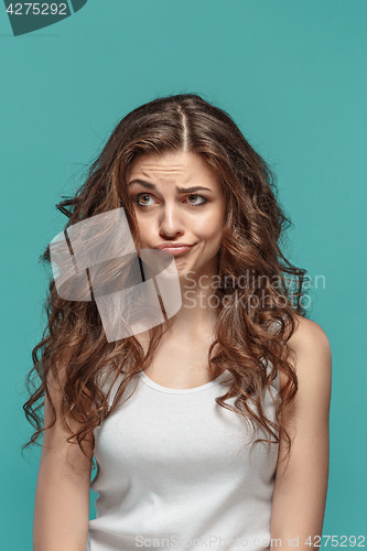 Image of The young woman\'s portrait with thoughtful emotions