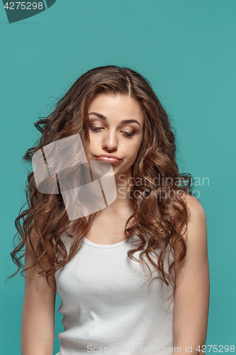 Image of The young woman\'s portrait with thoughtful emotions