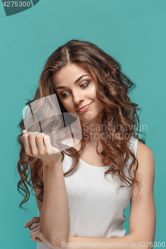 Image of The young woman\'s portrait with thoughtful emotions