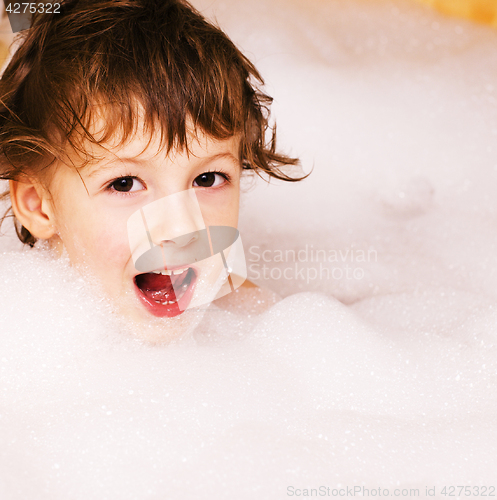 Image of little cute boy in bathroom with bubbles close up smiling, lifestyle real people concept