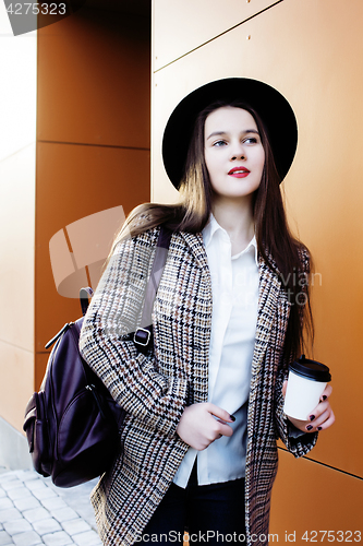 Image of young pretty hipster girl student with coffee cup posing adorable smiling, lifestyle people concept outdoor