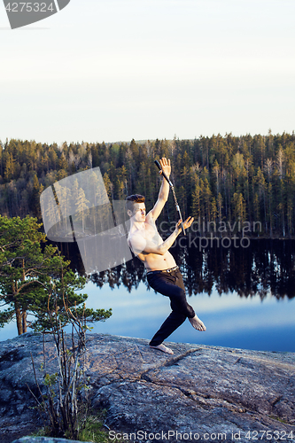 Image of middle age man doing sport yoga on the top of the mountain, lifestyle people outdoor, summer wild nature for training