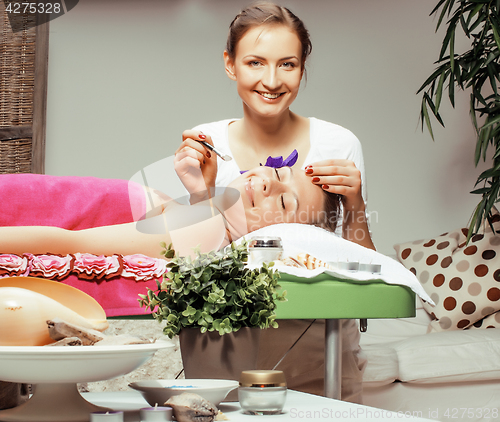 Image of photo attractive lady getting spa treatment in salon with cheerful doctor smiling caucasian people