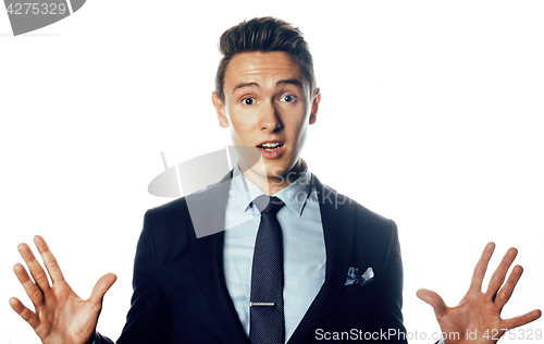 Image of young handsoman businessman fooling aroung isolated on white background, modern real people concept business