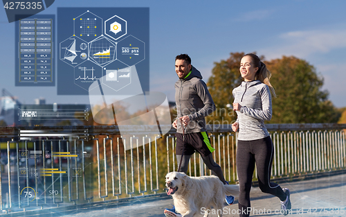 Image of happy couple with dog running outdoors