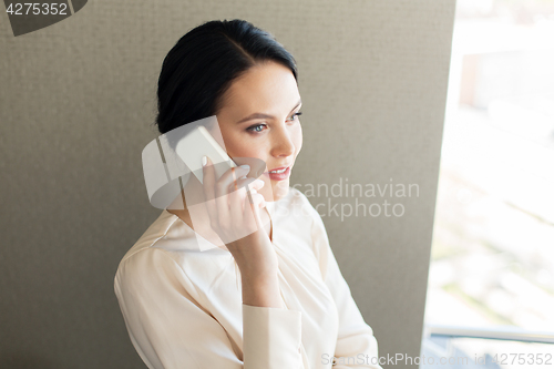 Image of businesswoman calling on smartphone