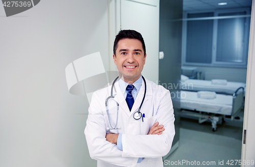 Image of smiling doctor with stethoscope at hospital 