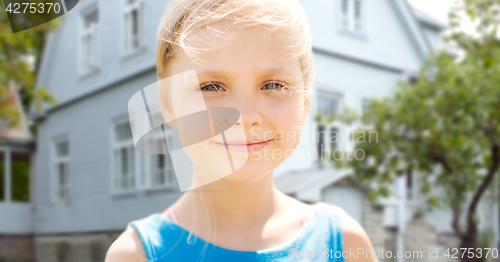 Image of happy little girl over living house background