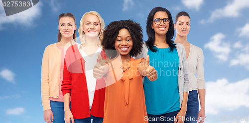 Image of international group of women showing thumbs up
