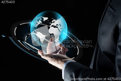 Image of businessman hand with smartphone and earth