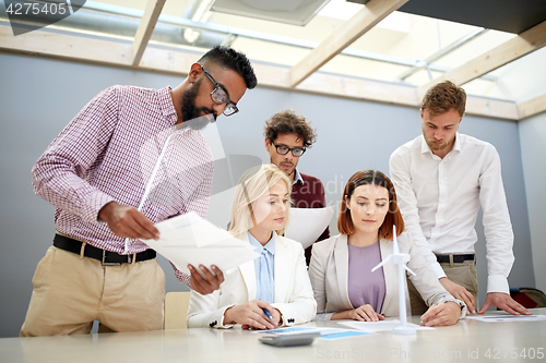 Image of business people discussing green energy project