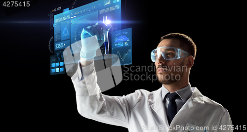 Image of scientist in goggles with test tube virtual screen