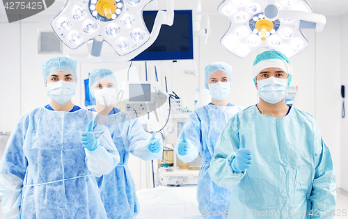 Image of group of surgeons in operating room at hospital