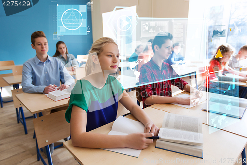 Image of group of students with books at school lesson