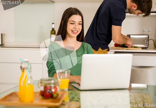 Image of Young couple on the kitchen