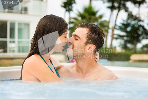 Image of Young couple in a jacuzzi