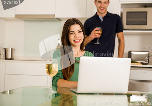 Image of Young couple on the kitchen