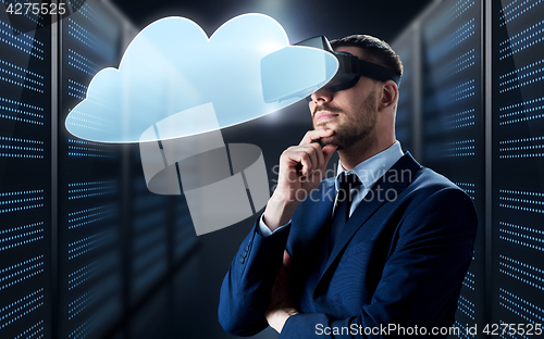 Image of businessman in virtual reality headset with cloud