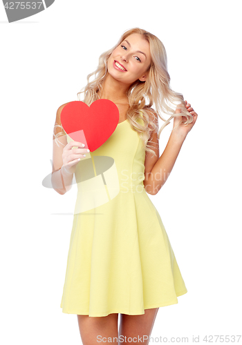 Image of happy young woman with red paper heart