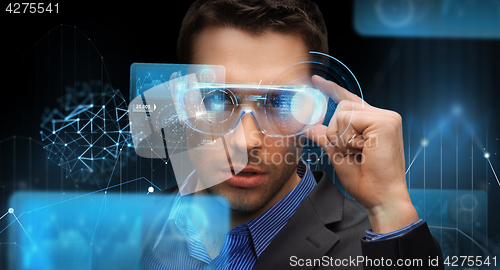 Image of businessman in virtual reality or 3d glasses