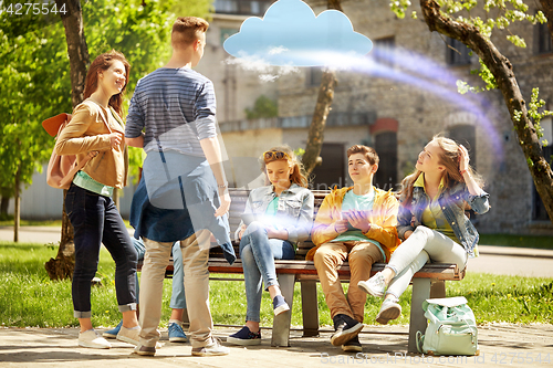 Image of teenage students with tablet pc at school yard