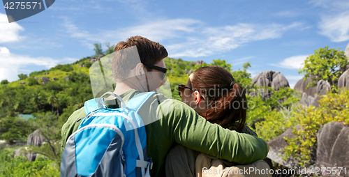 Image of happy couple with backpacks traveling