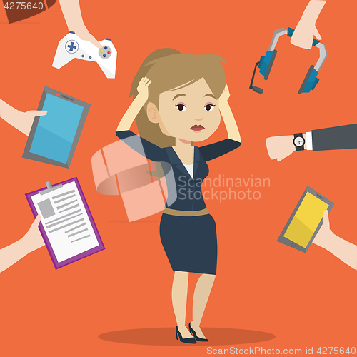 Image of Young woman surrounded with her gadgets.