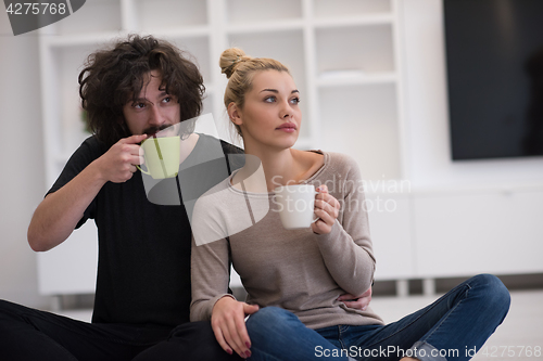 Image of young couple in their new home