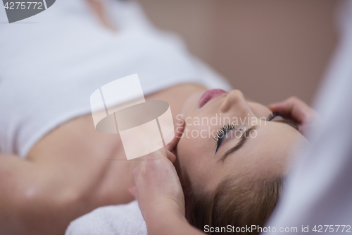 Image of woman receiving a head massage