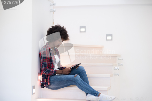 Image of black woman using her electronic tablet