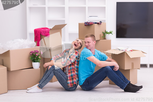 Image of young couple moving  in new house