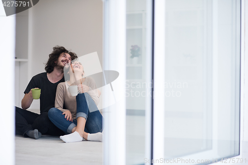 Image of young couple in their new home